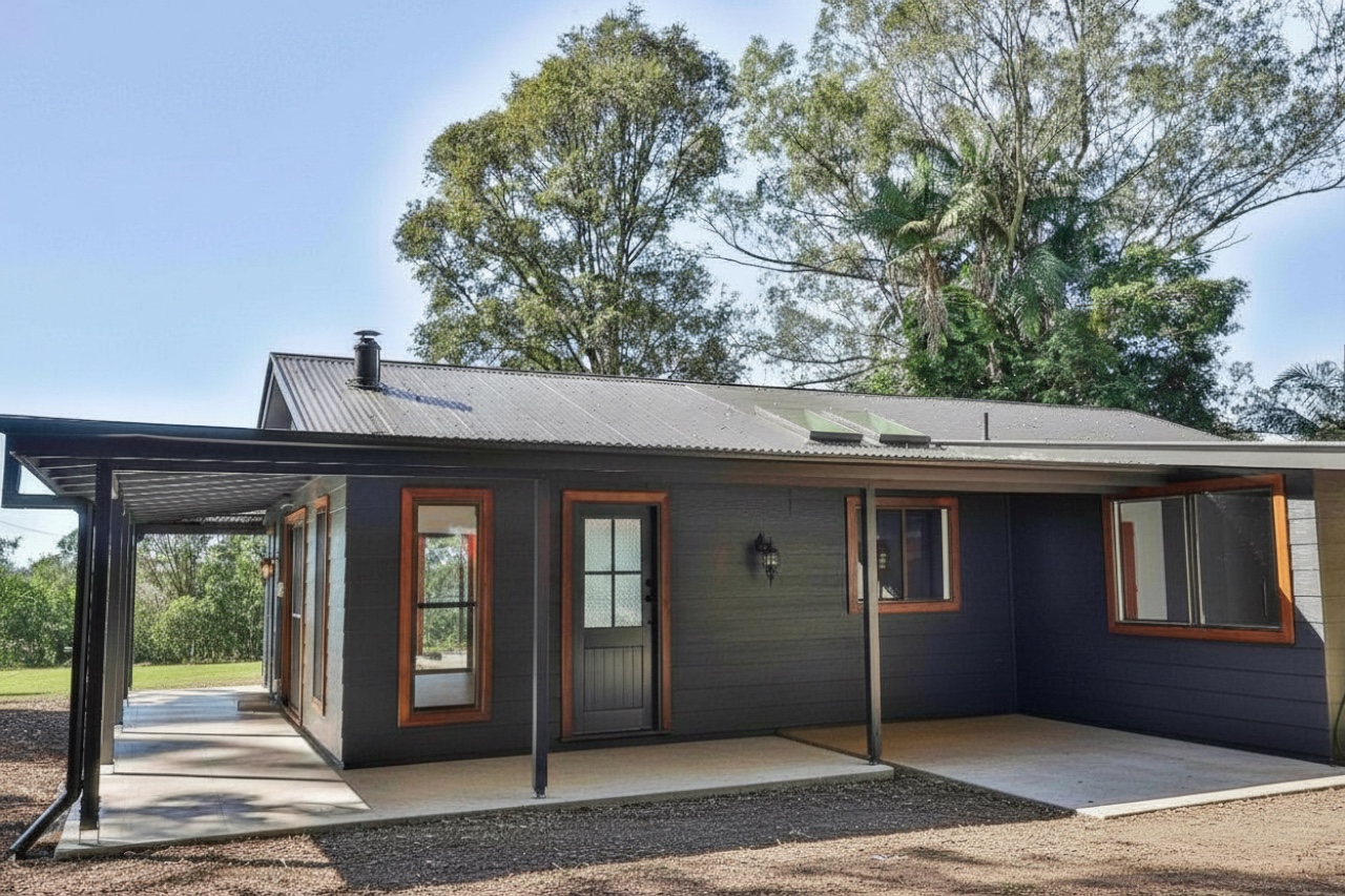 Front elevation of the dark-clad house at Corndale